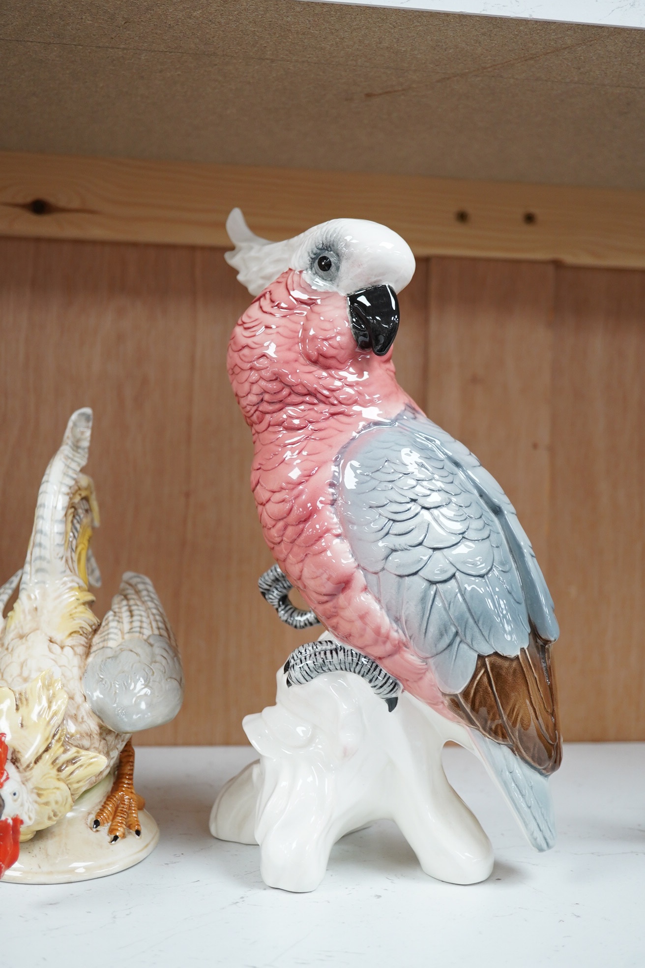 A large Beswick grey parrot, two chickens and a blackbird, parrot 29cm high. Condition - chickens glazing worn